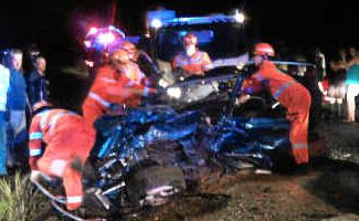Frantic efforts: Rescuers at the scene of a car crash on Orara Way at Glenreagh on Friday night. Frantic efforts: Rescuers at the scene of a car crash on Orara Way at Glenreagh on Friday night.